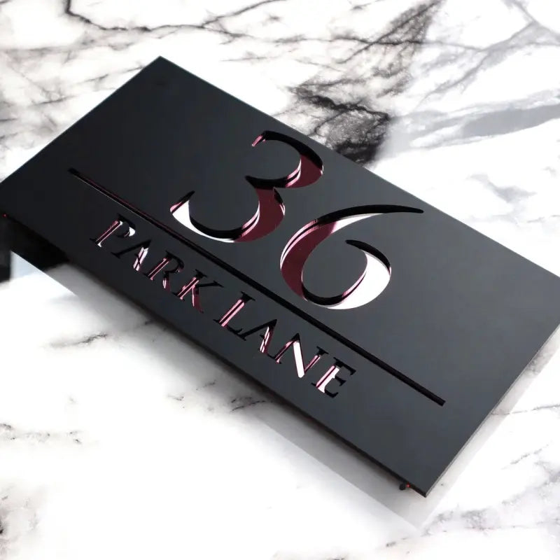 Hausnummernschild der Familie